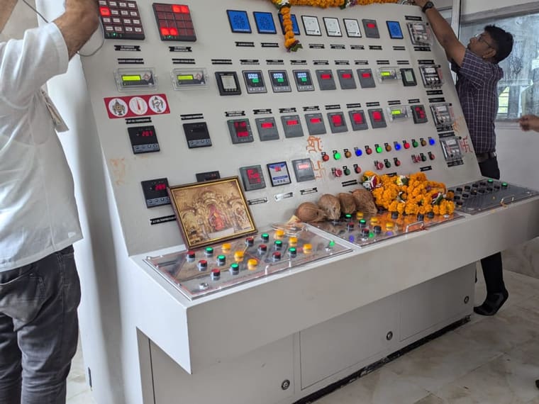 An operator at the process control panel